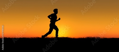Silhouette of running man against the colorful sky. Silhouette Man Running IN Sunset.
