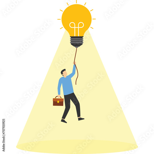 Burning light bulb makes businessman fly, isolated on blue background

