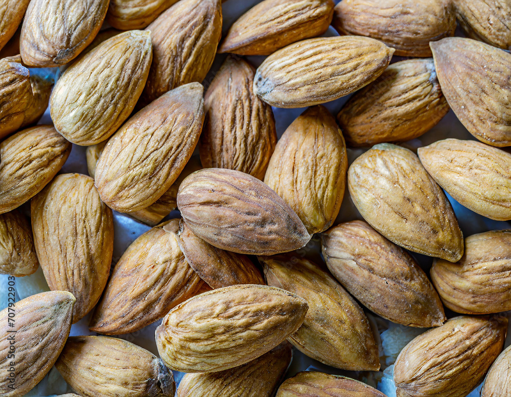 Fototapeta premium A pile of almonds. Closeup of almonds. 