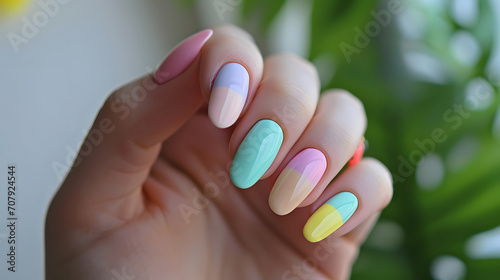 Hand with Pastel Colored Nail Polish Manicure