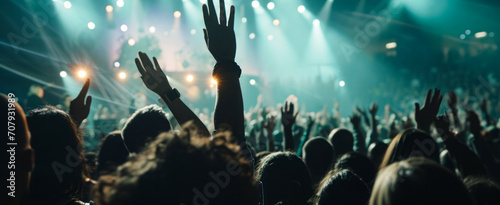 People dance as hands rise in a gesture of joy, while a rock band tirelessly plays. The harmony of sound and movement creates an unforgettable experience of unity and passion