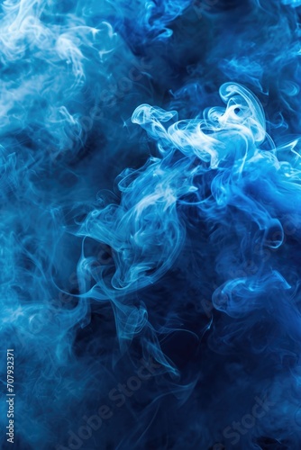 Blue smoke close up on a black background. Perfect for adding a touch of mystery and atmosphere to any project