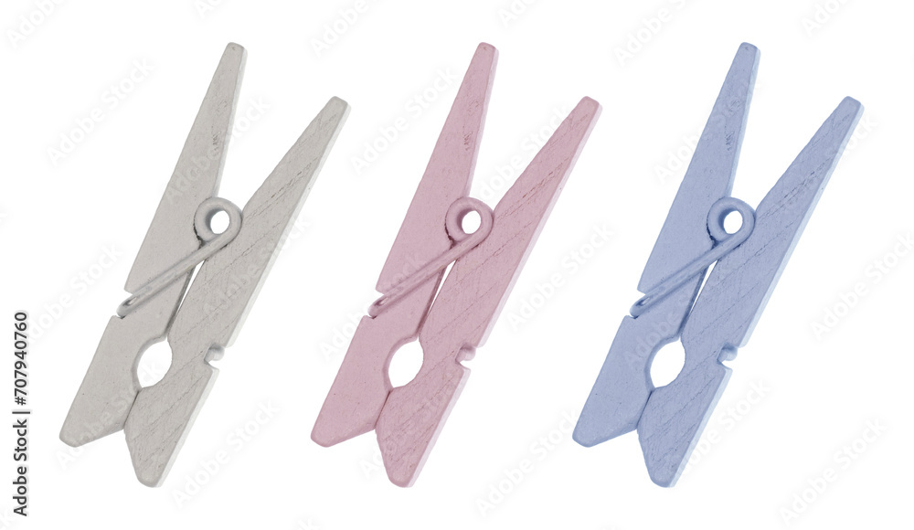 Set of 3 Wooden Pegs. off-White, Pastel Blue ane Light Pink Clothespins. No Background. Laundry equipment. Set of 3 Wooden Pegs. off-White, Pastel Blue ane Light Pink Clothespins. No Background. Laundry equipment.