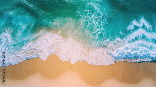 An aerial view of a sandy beach, with light blue waves and sunlit surroundings, creating a perfect backdrop for capturing the essence of vacation vibes