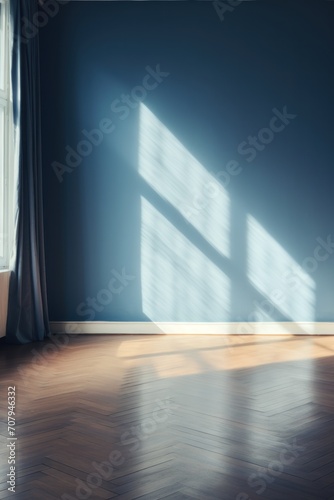 Light navy wall and wooden parquet floor  sunrays and shadows from window