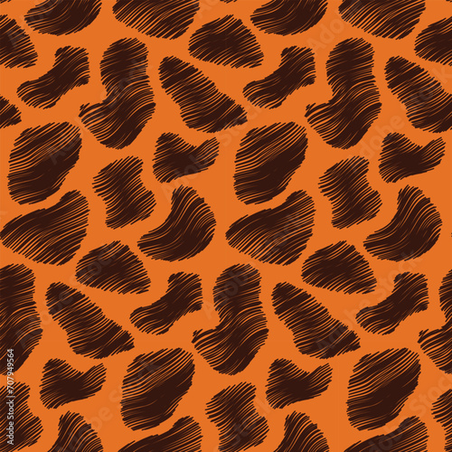 Animal skin seamless pattern. Dark brown scribbled chaotic spots on orange background