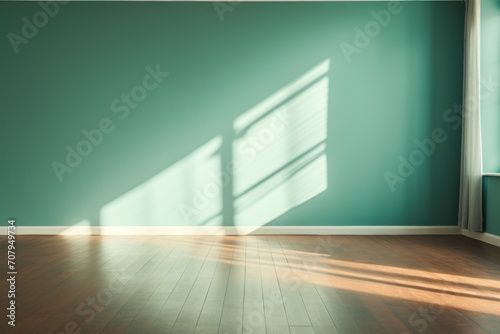 Light turquoise wall and wooden parquet floor, sunrays and shadows from window © GalleryGlider