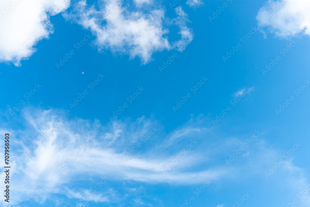 Beautiful blue sky with strange shape of clouds in the morning or evening used as natural background texture in decorative art work