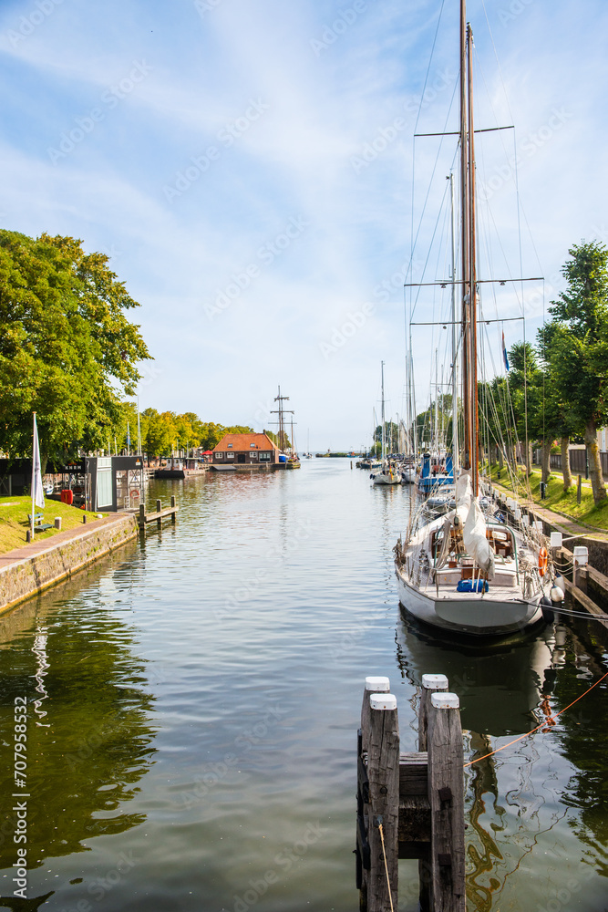 Sailing yachts and fishing boats moored in marina.Netherlands