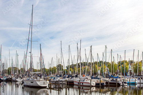 Sailing yachts and fishing boats moored in marina.Netherlands