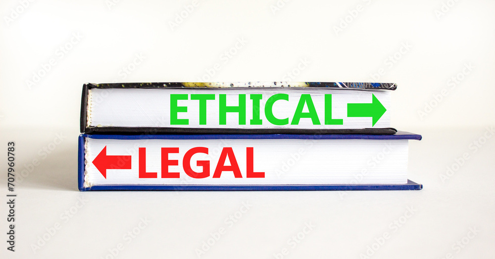 Ethical or legal symbol. Concept word Ethical or Legal on beautiful books. Beautiful white table white background. Business and ethical or legal concept. Copy space.
