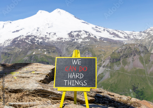 We can do hard things symbol. Concept words We can do hard things on beautiful blackboard. Beautiful mountain Elbrus background. Business, motivation we can do hard things concept. Copy space. © Dzmitry