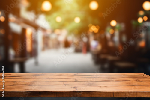 Wooden table blurred background of restaurant of cafe with bokeh © Studio One