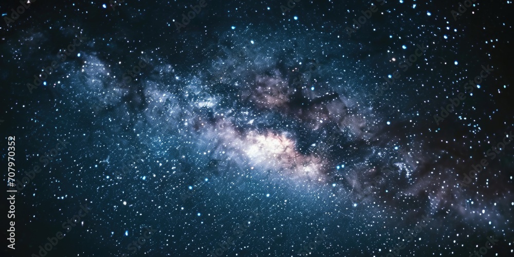 Obraz premium A stunning image of a large galaxy filled with countless stars. Perfect for illustrating the vastness and beauty of the universe. Ideal for science and astronomy-related projects
