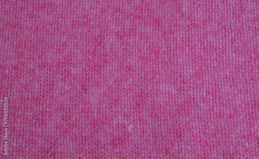 Fototapeta premium Pink weißer Grobstrick Woll Pullover aus Alpaca und Mohairwolle zur Hintergrund Nutzung 