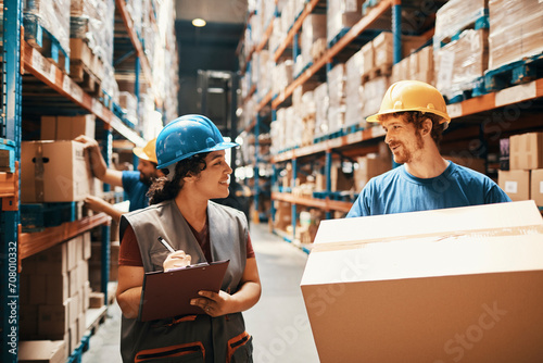 Logistics team working together in a warehouse photo
