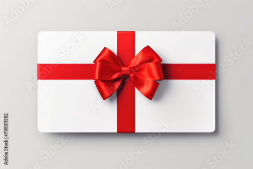 White envelope, gift card with red bow isolated on white background. View from above. Gift card. Birthday. Valentines day.