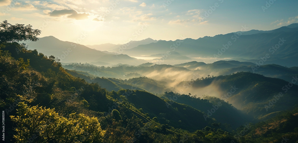 A sweeping panorama of a majestic mountain range with a misty morning sunrise A sweeping panorama of a majestic mountain range with a misty morning sunrise