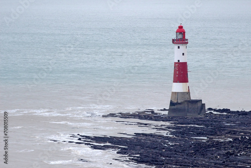 Close-up view of Beachy Head Lighthouse in East Sussex in low tide in the English Channel