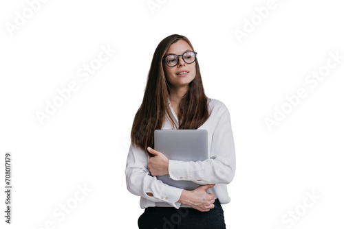 Confident manager woman in glasses wearing white shirt and black pants holding laptop looks aside against transparent background. Beautiful young student girl dreaming about career