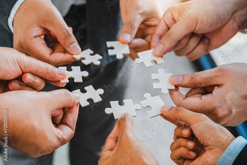 Business partner and partnership Hands join Jigsaw team spirit Collaboration global community teamwork .