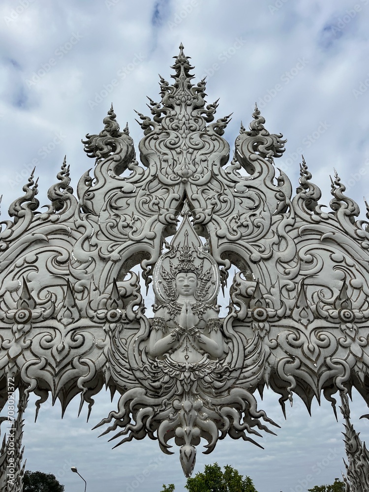The White Temple (Wat Rong Khun), Chiang Rai, North Thailand. Its striking white color and the use of mirrors in its design are unique features that contribute to its ethereal beauty and symbolism.