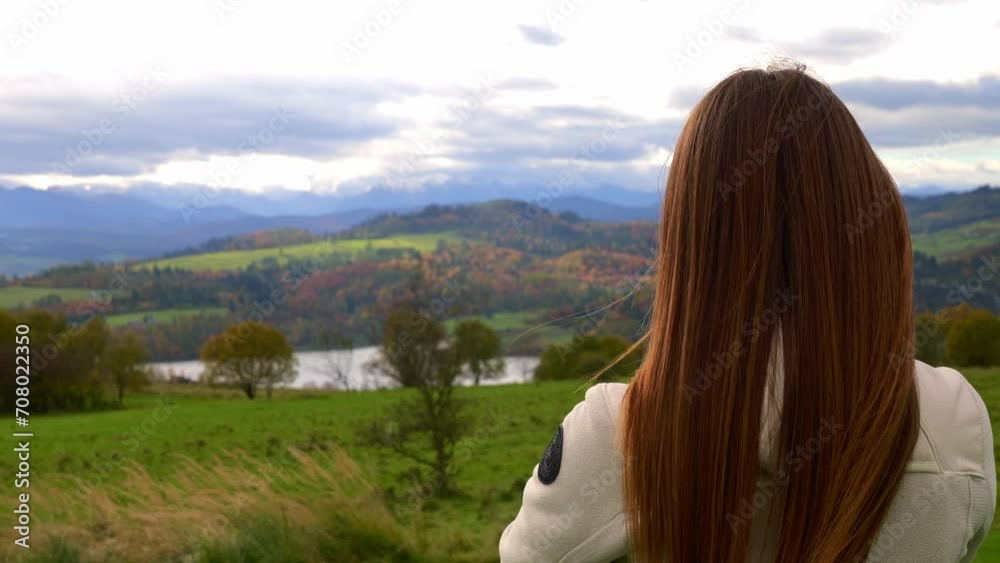 girl in the mountains thoughtfully examines nature girl in the mountains thoughtfully examines nature