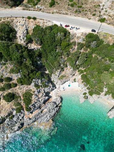 Drone view of Kako Lagadi beach, Kefalonia Island, Greece. Small scenic beach surrounded by big rocks; clear turquoise waters photo