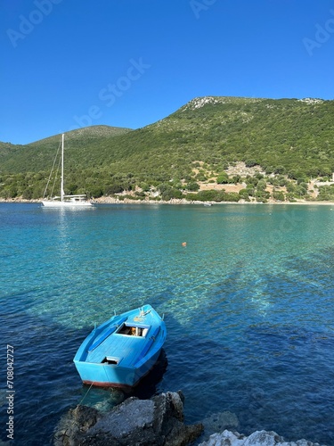 Wooden boats at the turquoise waters of Ionian Sea, Atheras beach, Kefalonia island, Greece