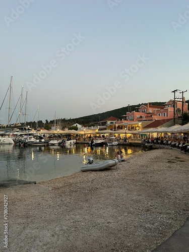 Fiskardo village at sunset time, Kefalonia Island, Greece. Greek Island architecture and yacht harbour
