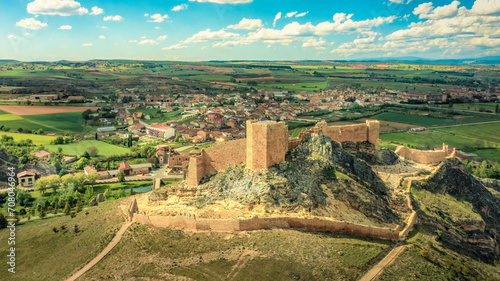 El Burgo de Osma medieval castle and town aerial view in Castille and Leon, Spain with blue sky on a sunny with cloudy day photo