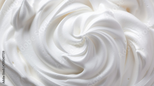 Whipped white cream cheese with soft waves backdrop close up macro texture background.