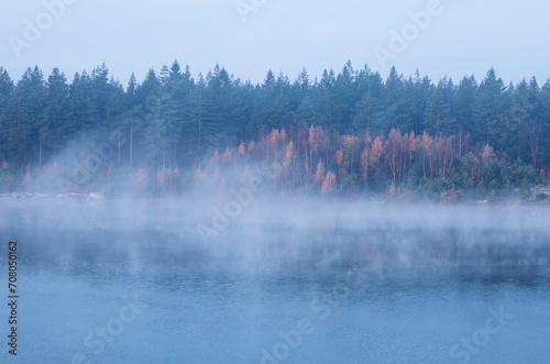 fog over large lake in autumn