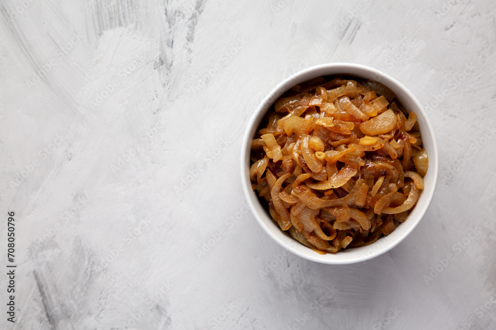Organic Caramelized Onions in a Bowl, top view. Flat lay, overhead, from above. Organic Caramelized Onions in a Bowl, top view. Flat lay, overhead, from above.