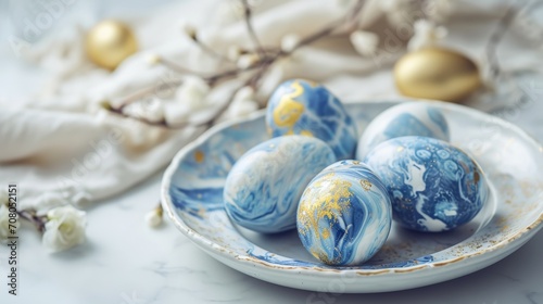 white blue eggs with gold patterns, blue marble in a beautiful plate on a white table with decor, Easter, quiet luxury style