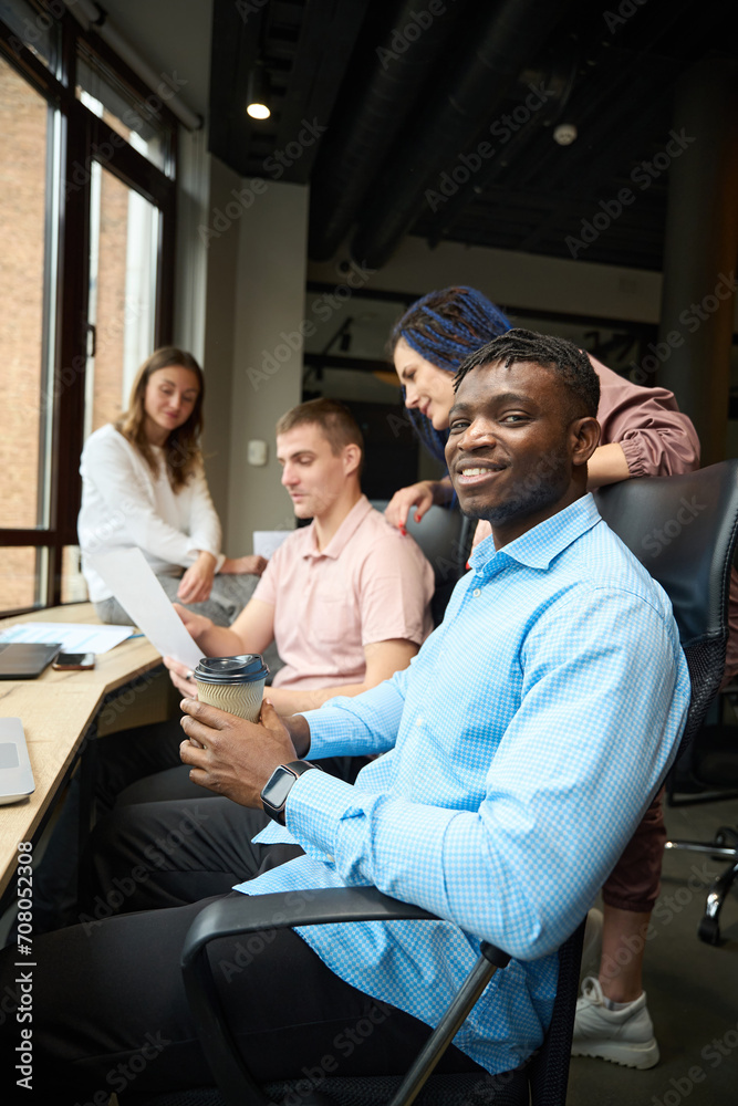 Fototapeta premium Smiling man manager of developing company looking at camera
