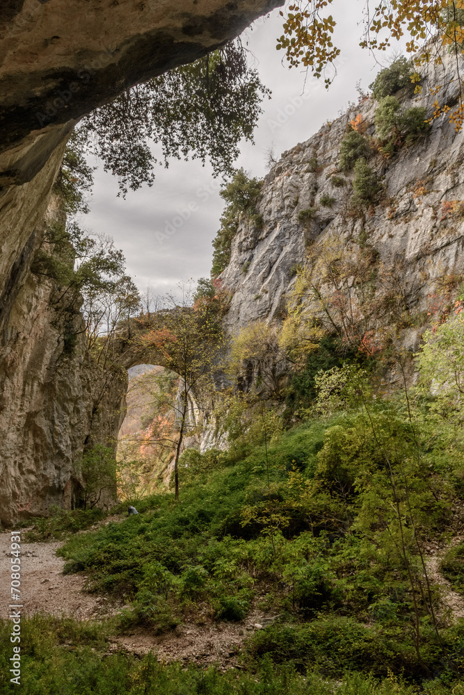 The rocky arch of Fondarca on the slopes of mount Nerone, in Marche region, central Italy The rocky arch of Fondarca on the slopes of mount Nerone, in Marche region, central Italy