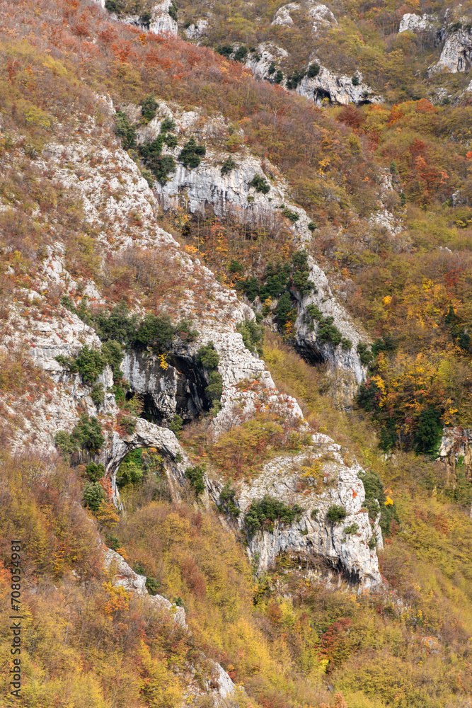 The slopes of mount Nerone in Marche region during the autumn, with the rocky arch of Fondarca