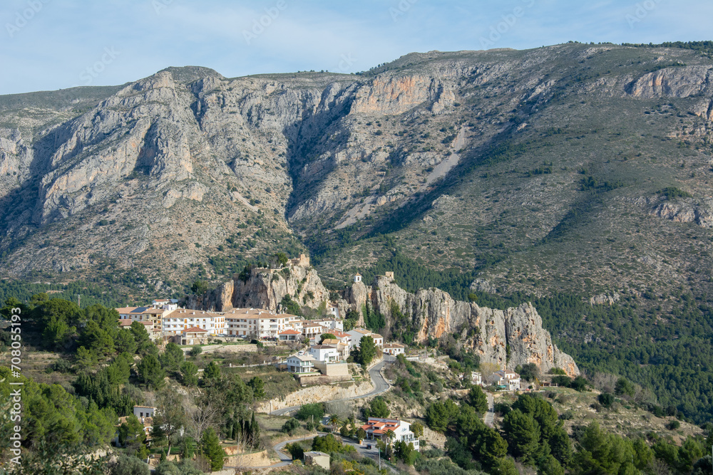 View of the medieval Guadalest castle  with a part of the fortifications in the tourist town of Guadalest in a mountainous area of the Marina Baixa comarca, in Alicante, Spain
