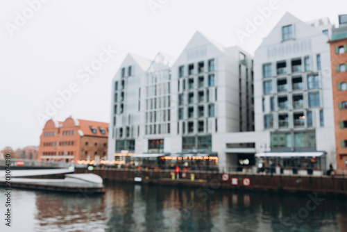 Blurred background of canal outside, modern city backdrop. Gdansk, Poland