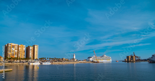 Panoramic view of Malaga city with the harbor area of "Muelle Uno". In background the Cathedral of Malaga. Famous travel destination in Andalucía. One of the most visited cities in Europe.