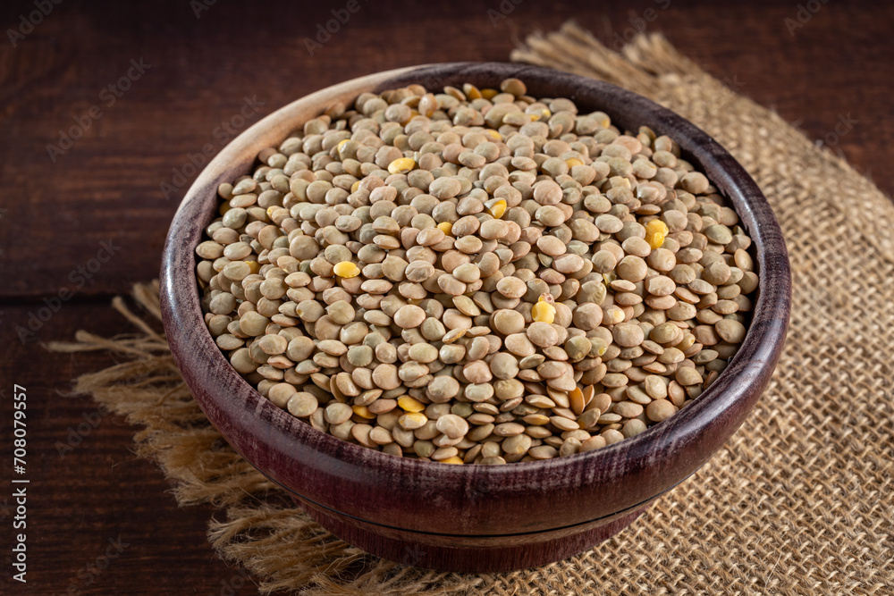 Green lentils in the bowl on the table. Green lentils in the bowl on the table.
