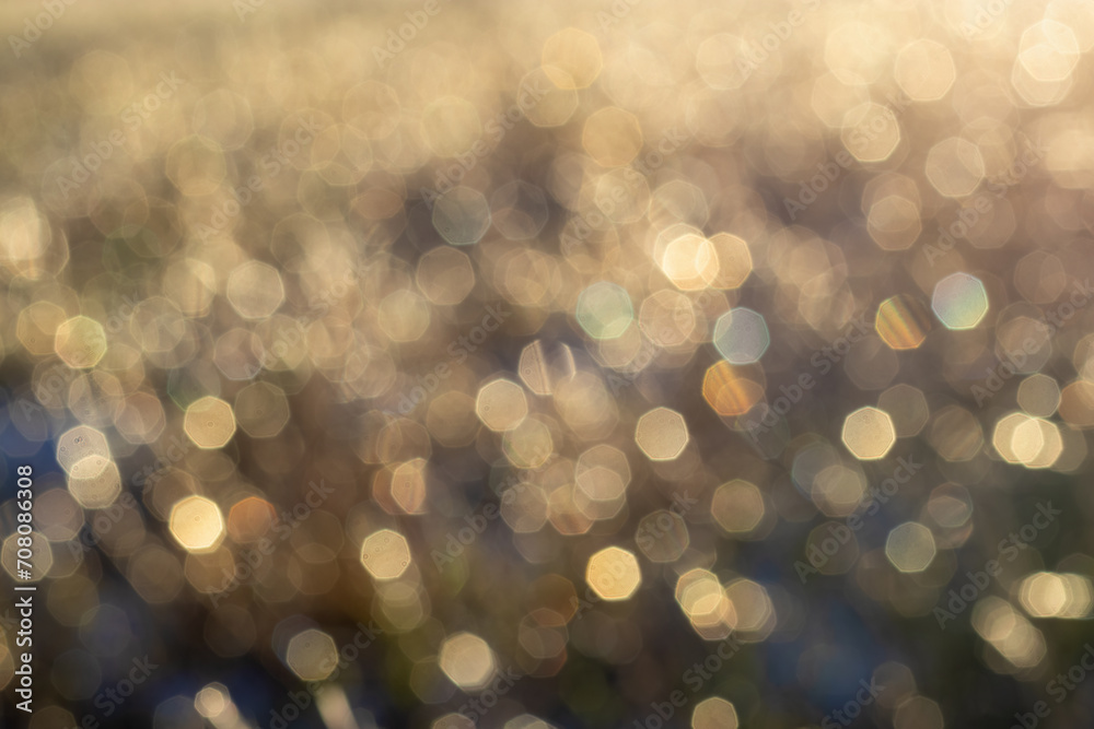 An abstract background created by nature itself. Diffuse reflections of small ice floes in the background light. Beauty in nature, atmospheric mood. Light scattering in lens An abstract background created by nature itself. Diffuse reflections of small ice floes in the background light. Beauty in nature, atmospheric mood. Light scattering in lens