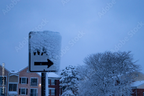 Cuadro en lienzo the street sign is covered with snow outside in the cold