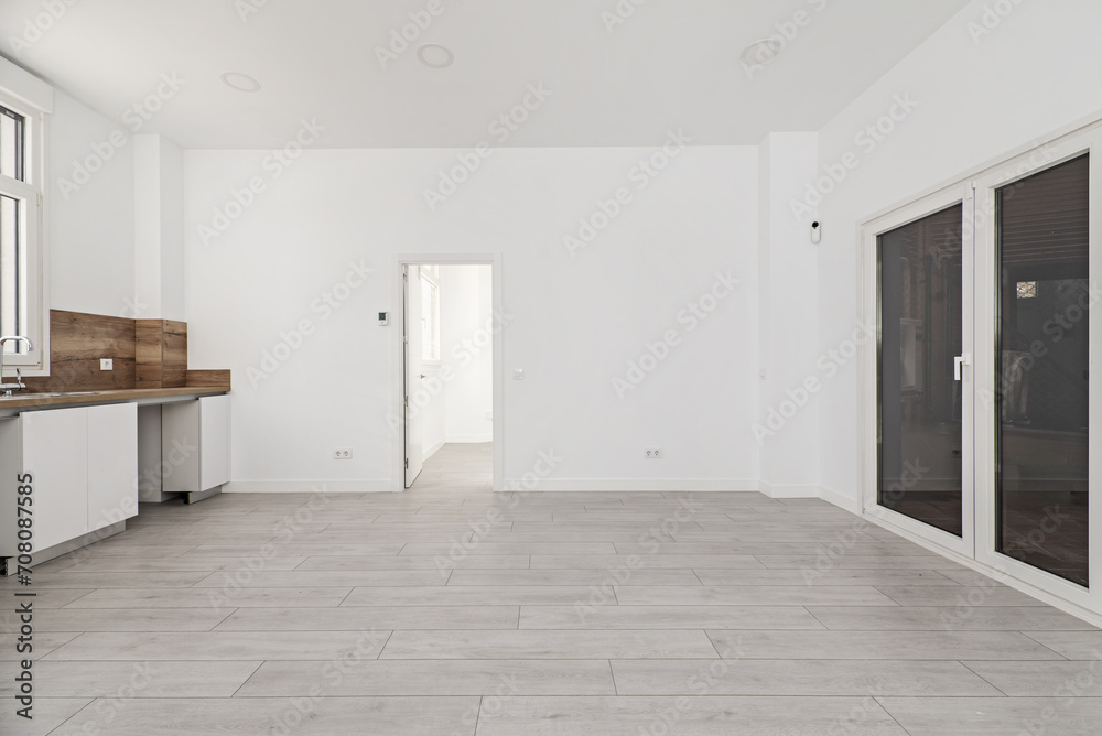 Newly renovated open kitchen with white wooden furniture Newly renovated open kitchen with white wooden furniture