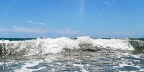 Fototapeta Naklejka Na Ścianę i Meble -  Blue sea  wiht wave and blue sky background. Summer sea and blue sky.