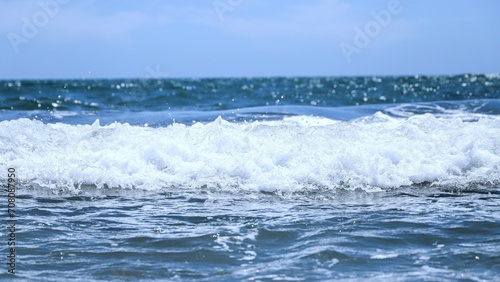 Fototapeta Naklejka Na Ścianę i Meble -  Blue sea  wiht wave and blue sky background. Summer sea and blue sky.