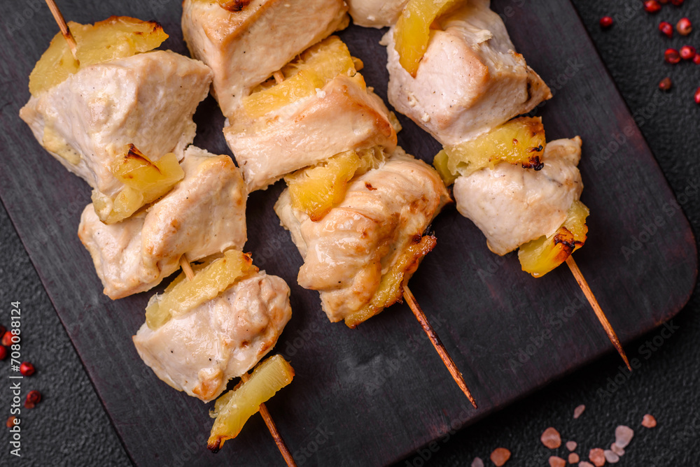 Delicious chicken or turkey kebab with pineapple pieces on skewers