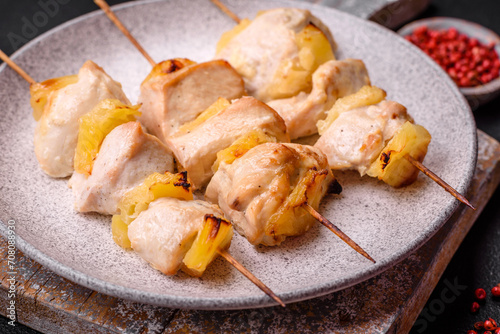 Delicious chicken or turkey kebab with pineapple pieces on skewers