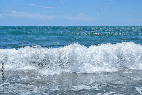 Blue sea  wiht wave and blue sky background. Summer sea and blue sky.